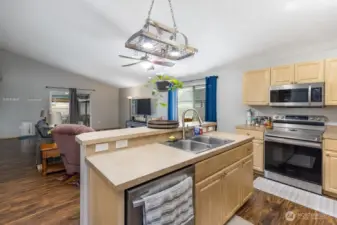 Kitchen looks out to dining and living