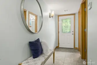 Your entry has room for a bench or shoe storage.