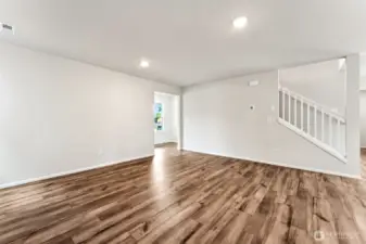 Open Concept living/Dining/Kitchen-Disclaimer- Photos are from a similar floor plan from another community, photos are for illustrative purposes only. Finishes, flooring, features, upgrades, countertops, paint, colors, and other features may vary.
