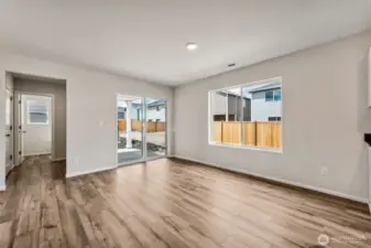 Open Concept living/Dining/Kitchen-Disclaimer- Photos are from a similar floor plan from another community, photos are for illustrative purposes only. Finishes, flooring, features, upgrades, countertops, paint, colors, and other features may vary.