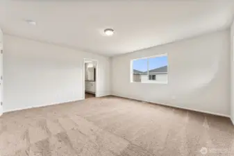 Primary Bedroom-Disclaimer- Photos are from a similar floor plan from another community, photos are for illustrative purposes only. Finishes, flooring, features, upgrades, countertops, paint, colors, and other features may vary.