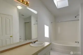 Primary bath with skylight.