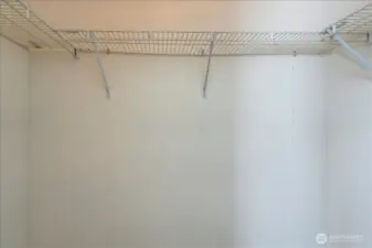 Primary bedrooms' large walk-in closet.