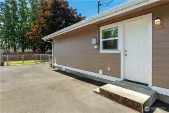 Exterior side door into utility/mudroom