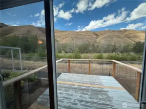 sliding door open to porch and sounds of the river