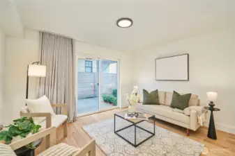 The entry level den/family room (in a townhome?!) is very spacious and has sliding doors to the adjacent outdoor patio.