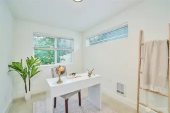 The entry level also features a bedroom that is currently staged as an office. The interior walls of the home have been recently painted and the carpets professionally cleaned.