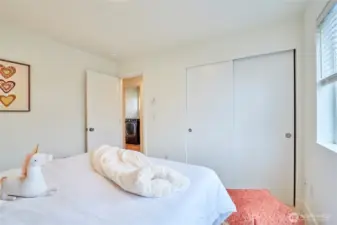 Another look at the second bedroom and closet. The laundry room is conveniently located across the hall.