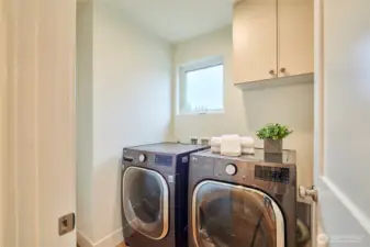 The hall laundry room finishes up the top level. Unlike most townhomes, this is an actual laundry room, not a closet with stacked washer and dryer.