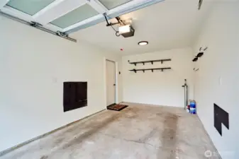 The garage is entered off the alley and is wired for an electric car charger.