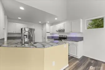 Stainless Steel appliances, lots of cabinets, counter-tops & a Lg pantry.