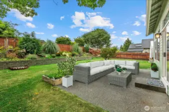 Patio area & backyard. Virtually staged.