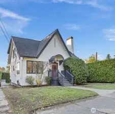 This 1925 Tudor has been lovingly maintained and  updated with care. Enjoy refinished hardwood floors, new engineered wood upstairs, and fresh  carpet on the stairs. Custom windows and top-down cellular shades add light and efficiency,  while behind the scenes, a new copper electrical panel, grounding rods, and outdoor outlet for  car charging bring peace of mind and modern convenience.