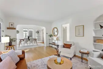 The distinctive tudor style archway welcomes you to the dining room with plenty of beautifully paned windows bringing in the sunlight.