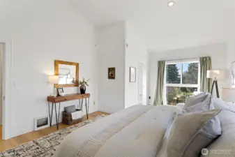 Plenty of space in the primary bedroom with cathedral ceilings, new windows and new engineered hardwood. You will love this bedroom with its magical views!