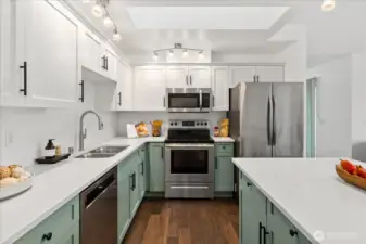 Newer oversized stainless refrigerator and new sink and faucet