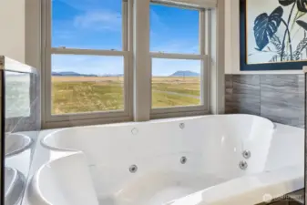 The extra-large jetted tub faces west so you can enjoy views of the bay while relaxing