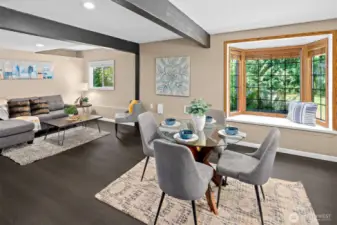 Beautiful Bay Window with seating, dining area, and living area.