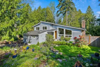 Incredible home on a lovingly landscaped .65 acre private lot.