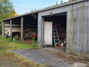 Shop with spacious interior and a garage. Perfect place to work on your hobbies.