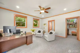 Home office adjacent to the kitchen. Could also be considered an ensuite.