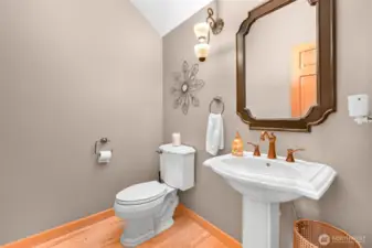 Powder bathroom next to the living area and bonus room.