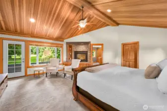 Primary suite with private deck overlooking the backyard and golf course.