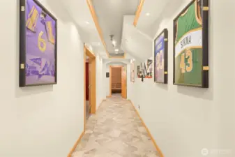 Hallway downstairs leading the the home theater, gym, and sauna.