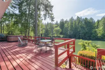 Wrap-around deck is perfect for enjoying the hot tub, outside dining, and watching the marine life.