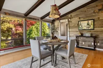 Kitchen eating space with large windows Door to the right leads to junior en-suite.