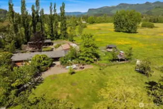 Includes barn, greenhouse, and established DADU