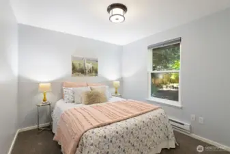 The second bedroom is tucked in the back corner of the house, quietly nestled in the trees and serenity.