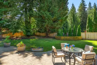 In every direction, this home's grounds have been thoughtfully manicured for easy maintenance, beauty, and privacy.
