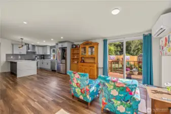 Dining Room with Vaulted Ceilings, has AC Unit to stay cool, dine your guest and have them look out at nature.