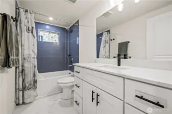 Full Bathroom, with shower, fully updated. Black accent handles and faucet.
