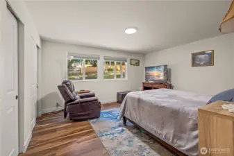 First bedroom in the hallway with expansive closet space, with view to the outside.