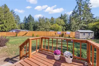 Entrance to utility room and mudroom. View of large backyard space for gardening, or parking your vehicles. Entertain guests outside.