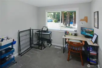 Third bedroom, currently used as an office and music room, with carpet—flexible living space in this Bonney Lake rambler.