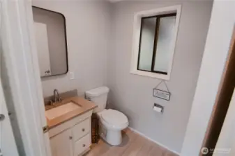Newer half bathroom just off the family room—modern convenience and thoughtful addition to this Bonney Lake rambler.