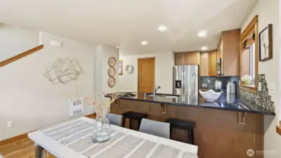 Spacious kitchen with lots of cabinet space + breakfast bar