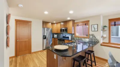 Spacious kitchen with lots of cabinet space + breakfast bar