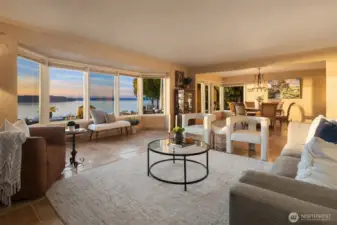 This elegant residence features a grand living room with panoramic, uninterrupted water views.