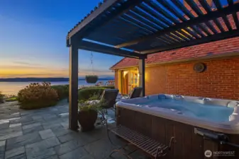 Soak your cares away in the hot tub and retire right to the primary suite. French doors shown here lead to the primary suite.