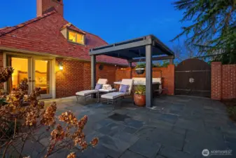 Private patio off the primary suite has a lounge area and hot tub.