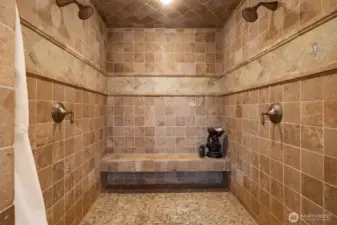 Indulge in the oversized walk-in shower with dual showerheads, designed for ultimate relaxation and convenience.