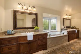 Primary bath offers a retreat-like experience with a spacious walk-in shower, premium fixtures, heated floors & a deep soaking tub.