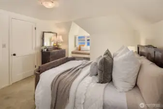 One of three upstairs bedrooms, all featuring a window seat.
