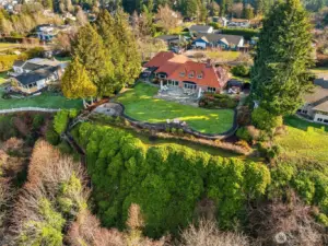 This exclusive home is perched high above the water on a double lot and is professionally landscaped with meticulously manicured lawn and gardens.