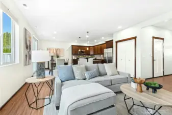 Living looking into open kitchen and dining.