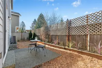 low maintenance backyard with flower beds.